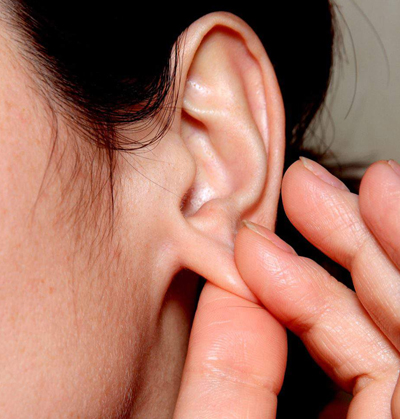 Professional ear lobe reconstruction and re-piercing treatment in Kochi